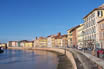 Walking On The Banks Of The River Arno In Pisa